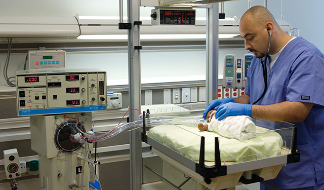 A High-Frequency Oscillation Ventilator (HFOV) supporting an infant in a Neonatal Intensive Care Unit (NICU), used for advanced lung-protective ventilation.